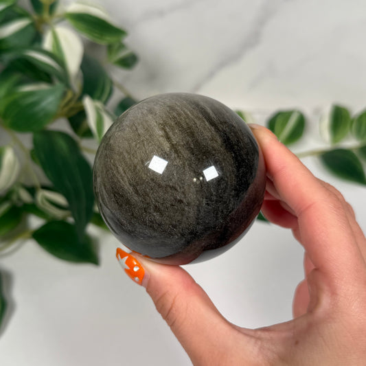 Gold sheen obsidian sphere