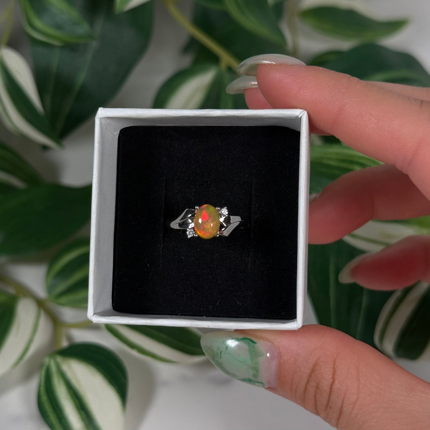 Size 6 Ethiopian opal with cubic zirconia ring