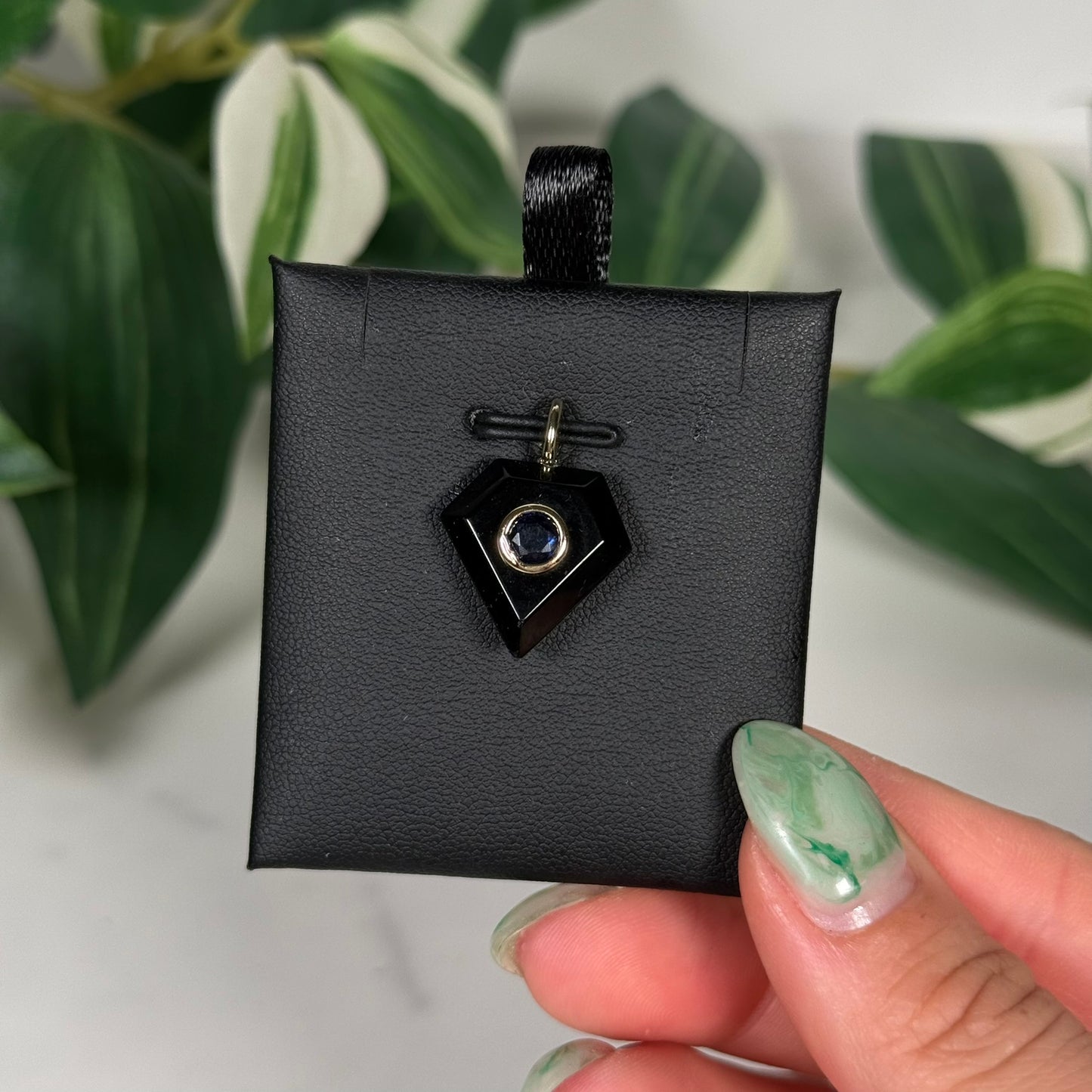 Obsidian with faceted kyanite diamond shaped pendant