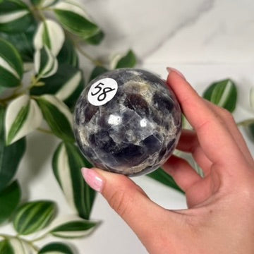 Iolite with sunstone sphere