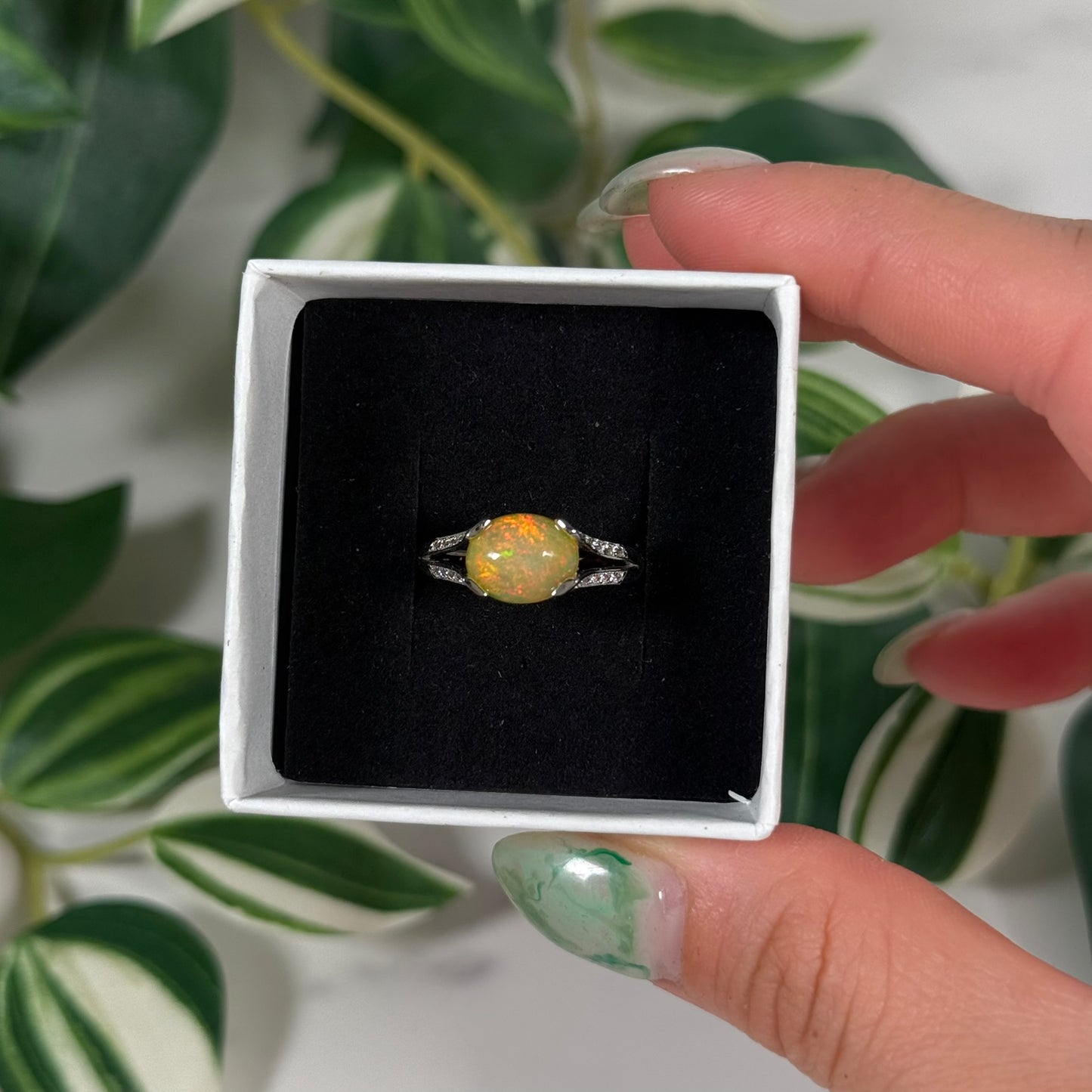 Size 8 Ethiopian opal with cubic zirconia ring