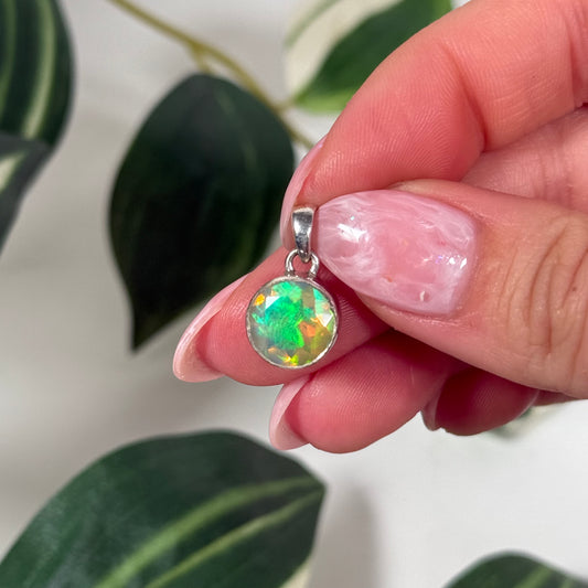 Faceted Ethiopian opal circle pendant