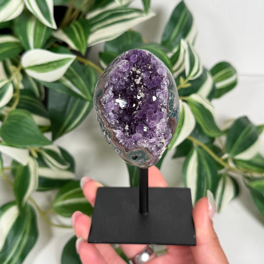 Amethyst with calcite on stand