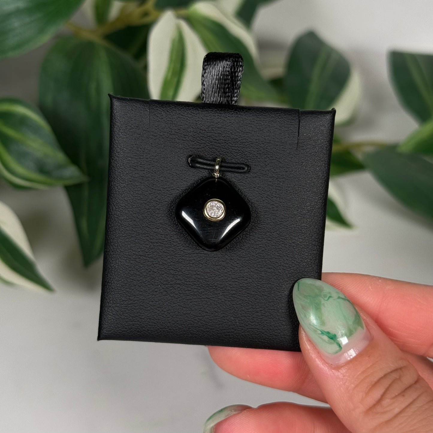 Obsidian with faceted topaz pendant