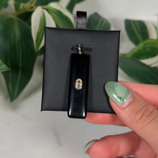 Obsidian with faceted pink topaz pendant