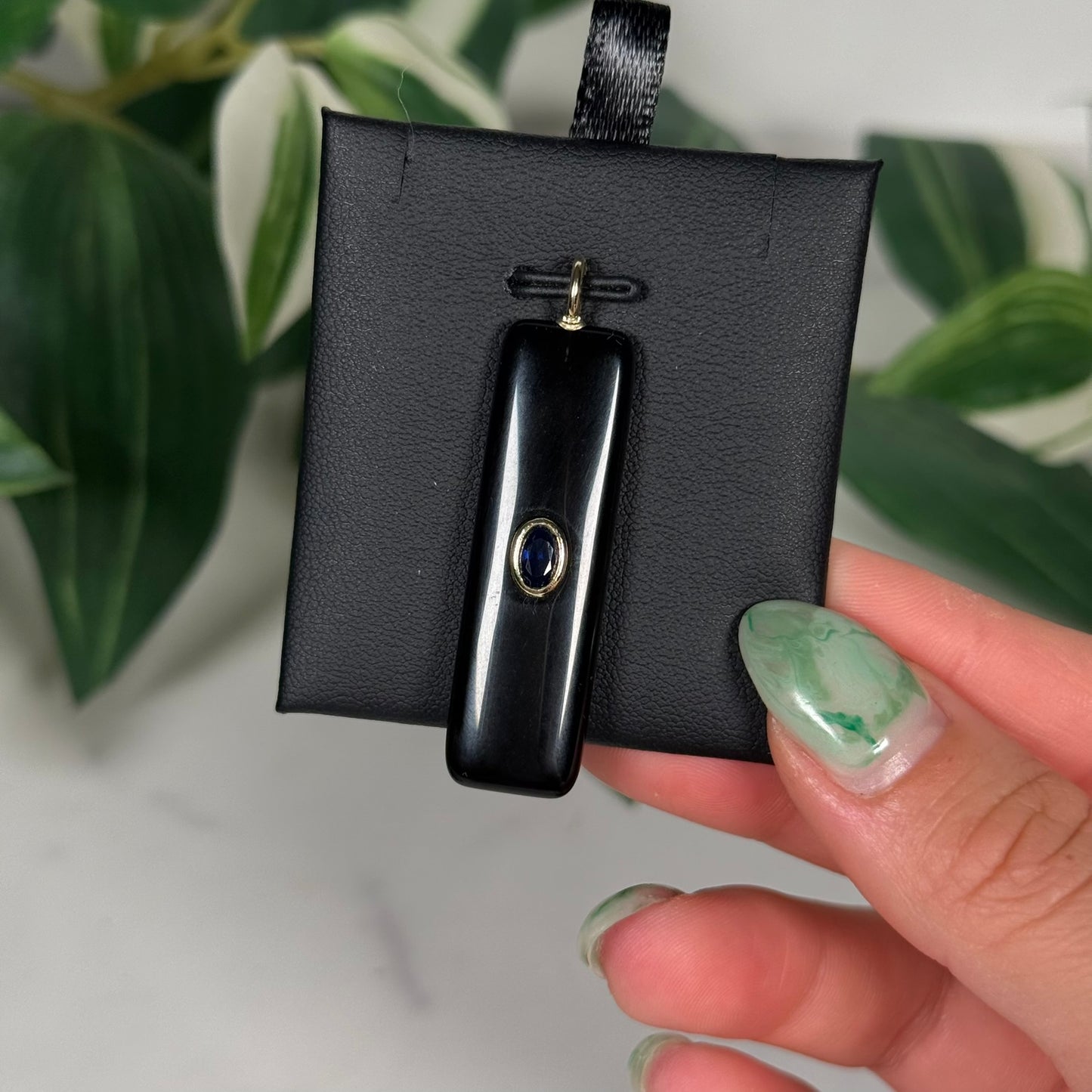 Obsidian with faceted kyanite pendant